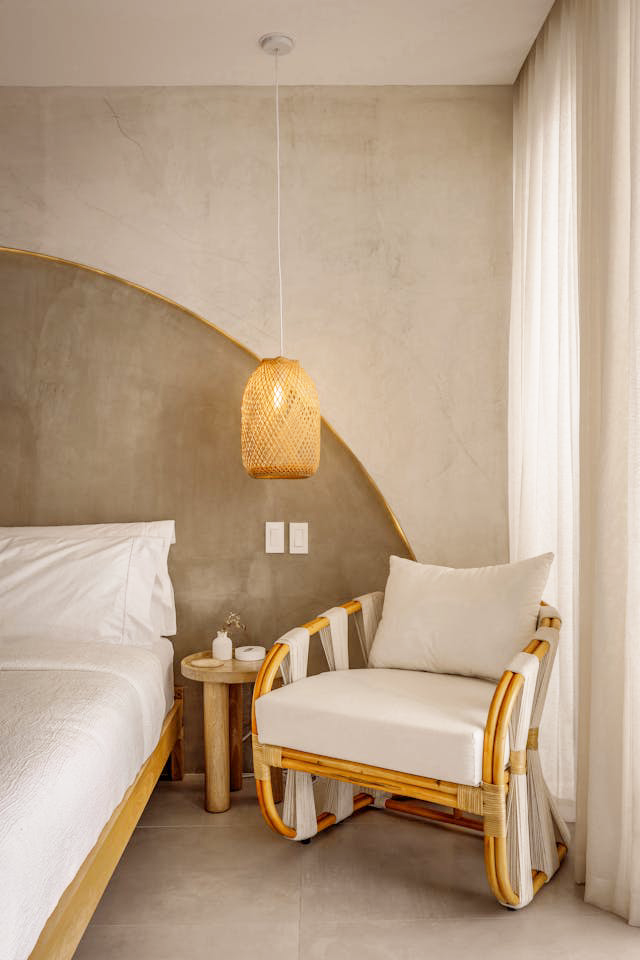 Accent chair next to a bed